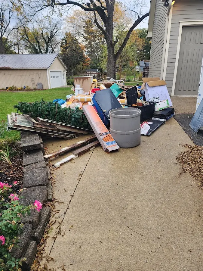 Dumpster being loaded with debris for Roofing Dumpster Rental in Sun Lakes